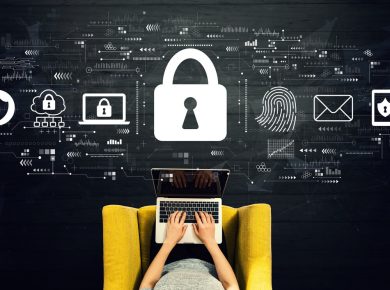 Person typing on a laptop on a yellow chair, with large padlock and digital security icons floating above, illustrating cybersecurity.
