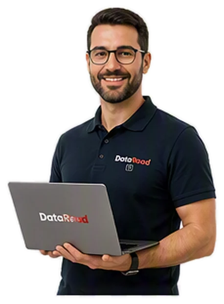 Man with glasses wearing a dark polo, holding a laptop displaying the DataRoad logo on his chest and screen